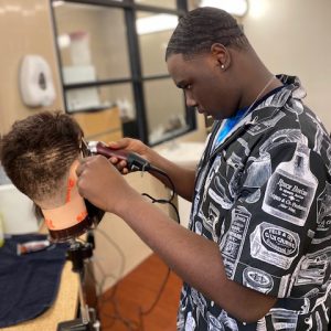 Barbering student clippers and demo head
