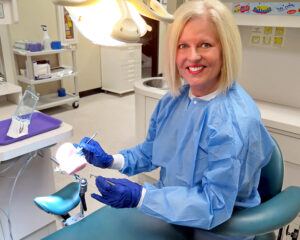Wendy Herndon dental assist by chair