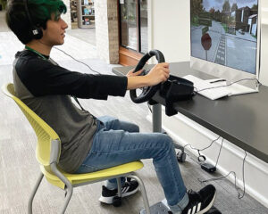 Student with driving simulator