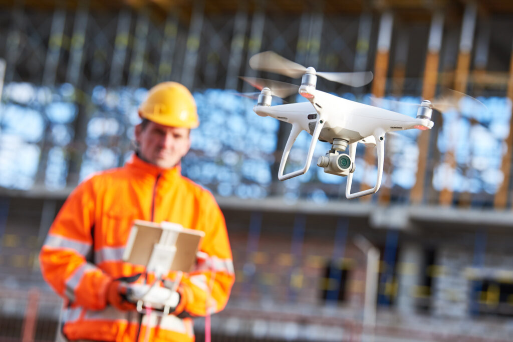 Construction worker flying drone
