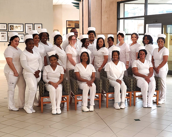Practical Nursing Group in white scrubs/hats