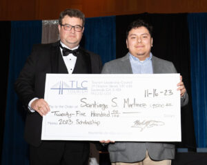 Michael Owens, Santiago Martinez with scholarship check
