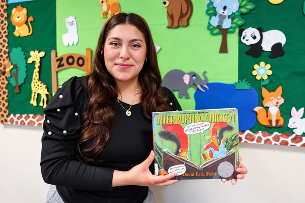Early_Childhood_Care_Education Early Childhood education student standing in front of bulletin board