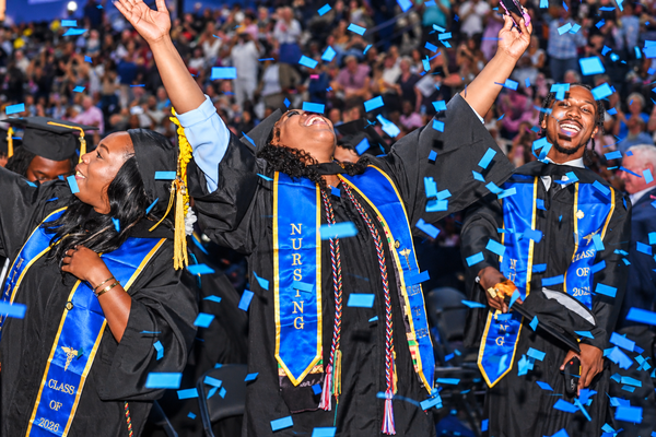 Nursing graduate celebrating